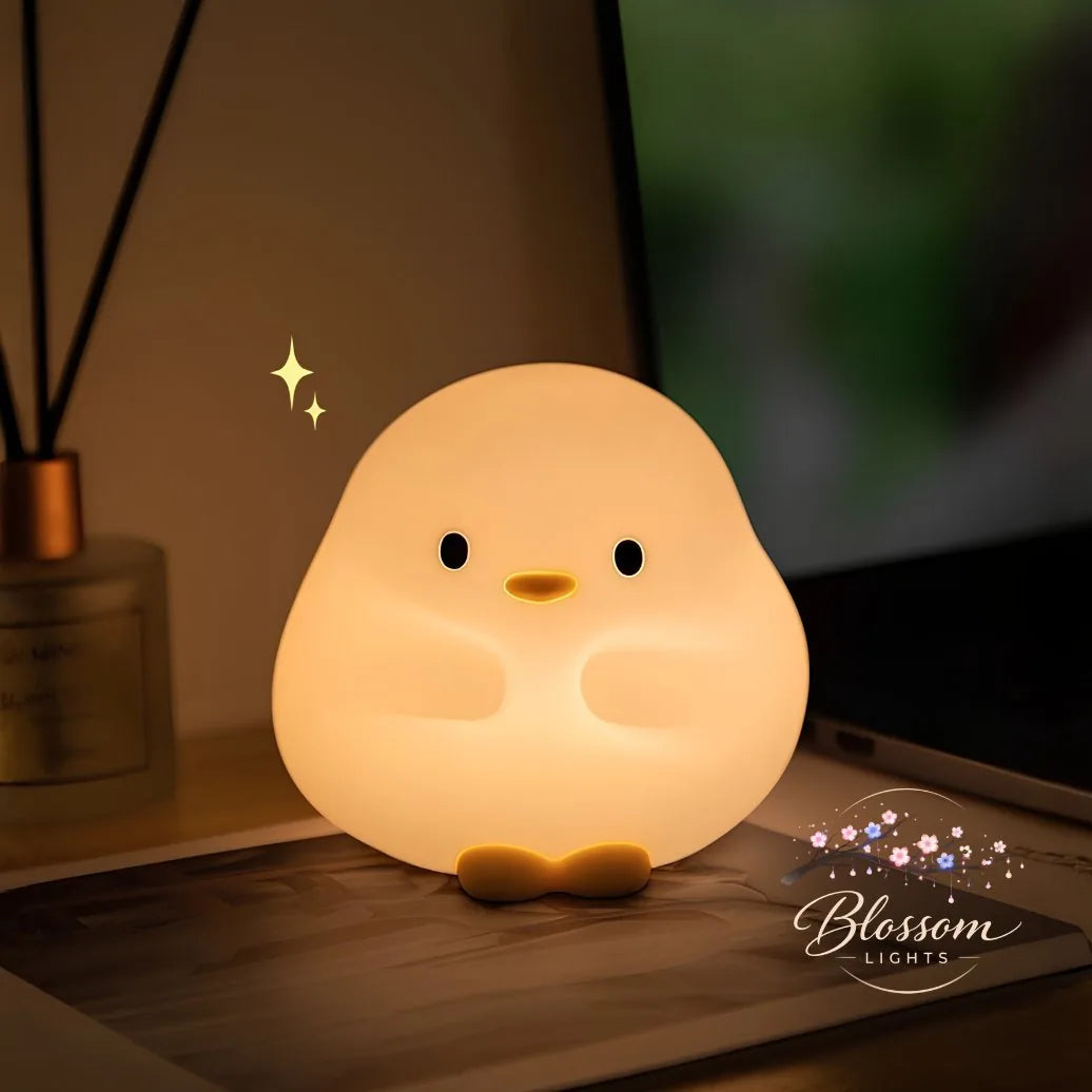 Ducky Glow patito de luz cálida sobre el escritorio